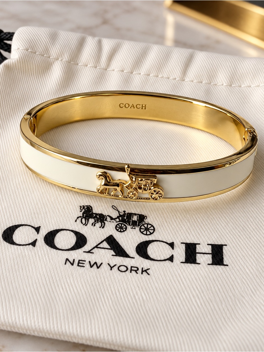 COACH Gold and White Horse & Carriage Enamel Bangle Bracelet